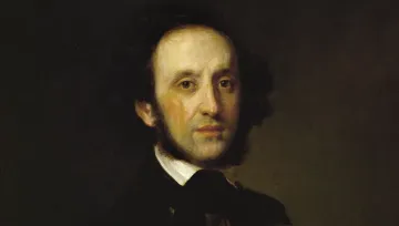 Retrato pintado de Felix Mendelssohn com expressão suave e olhar direto. Usa traje escuro com gola alta e gravata, em frente a um fundo neutro, com luz suave que destaca seu rosto e costeletas.